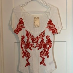 Free People top with lace and bead detail. Size M